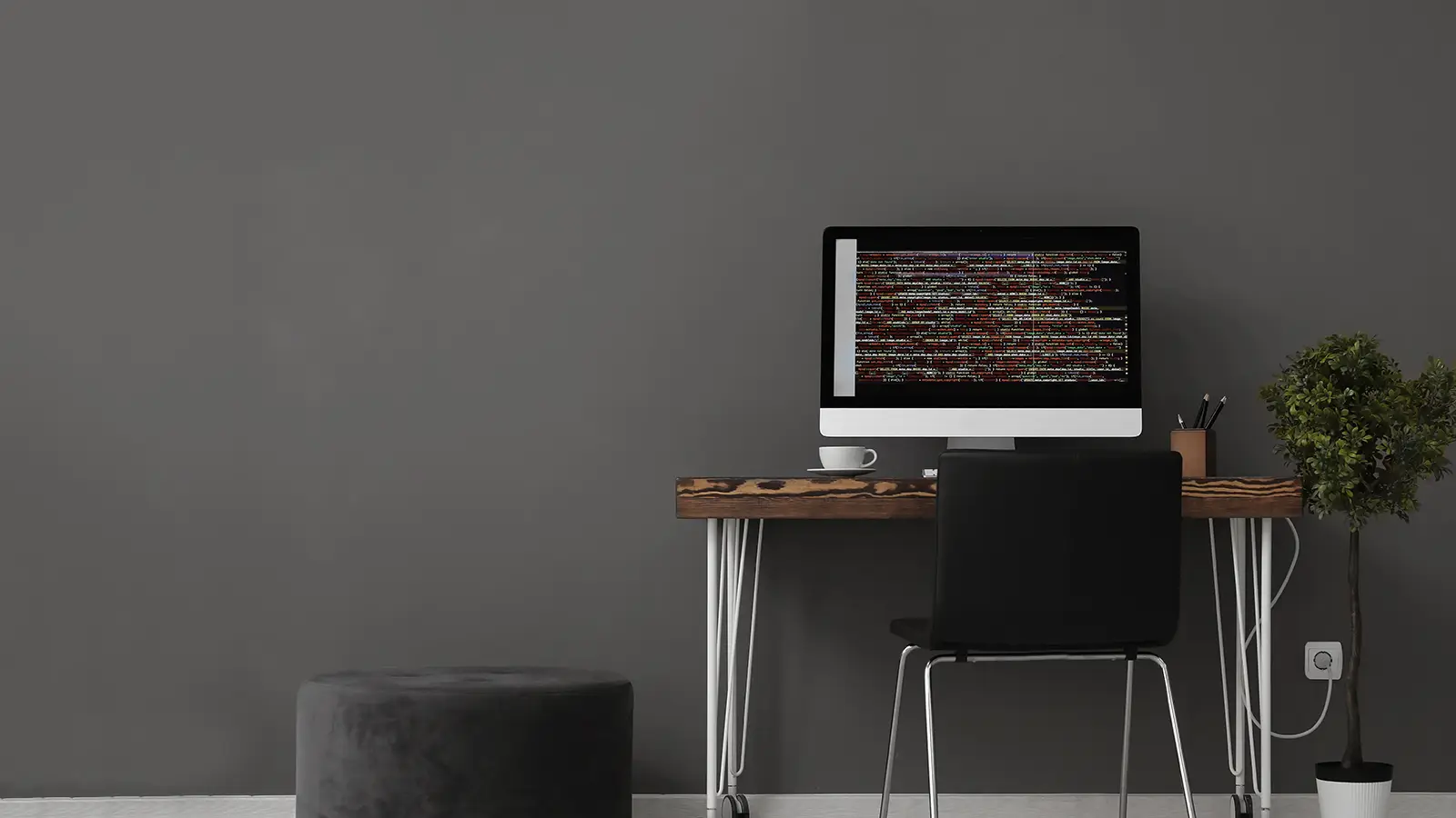 Minimal web development workspace with code displayed on a desktop computer